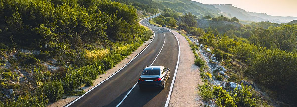 Car driving down road